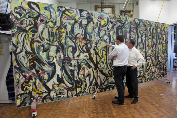 Tom Learner and Alan Phenix examining Jackson Pollock's Mural.