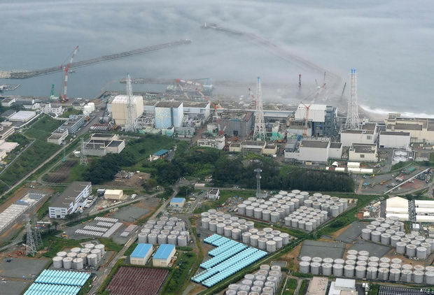 File photo of an aerial view showing TEPCO's tsunami-crippled Fukushima Daiichi nuclear power plant and its contaminated water storage tanks in Fukushima