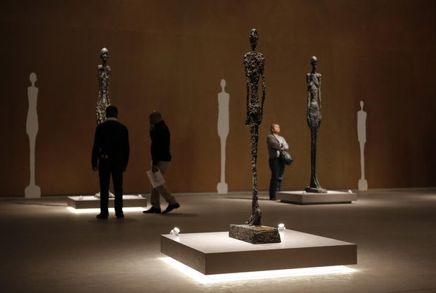 Visitors look at sculpures by Alberto Giacometti at the Leopold Museum in Vienna