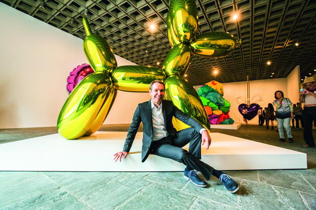 Artist Jeff Koons poses during a press preview before the opening of his retrospective at the Whitney Museum of American Art in New York
