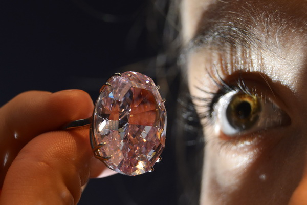 File photo of Model Murphy-Thomas posing with The Pink Star diamond at Sotheby's auction house in central London