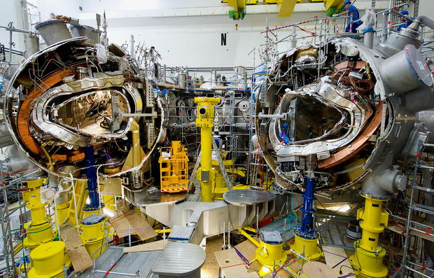 Mechanics work on the research reactor 'Wendelstein 7-X' at the Max-Planck-Institute for plasma physics in Greifswald, Germany, 10 November 2011. 520 staff members of the institute manufacture the nuclear fusion reactor experiment 'Wendelstein 7-X', which
