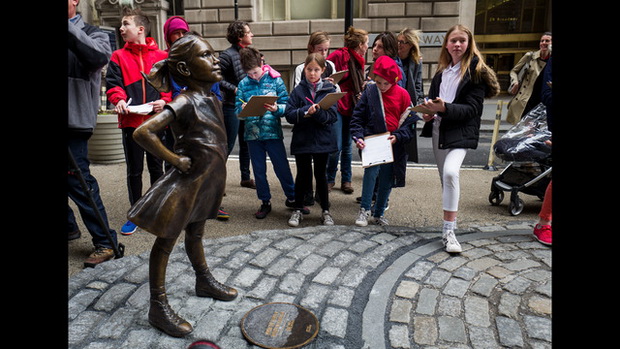 Statue Of Defiant Girl Installed In Front Of Iconic Wall Street Bull By Global Investment Firm