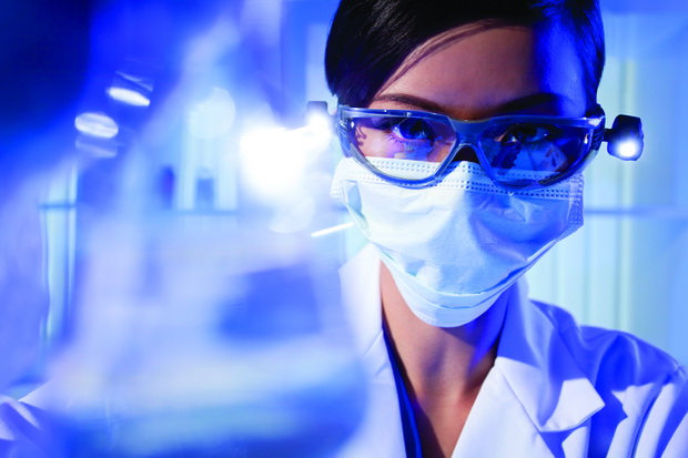 Chinese Female Woman Scientist With Flask In Laboratory