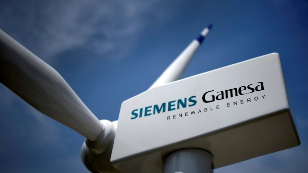 FILE PHOTO: A model of a wind turbine with the Siemens Gamesa logo is displayed outside the annual general shareholders meeting in Zamudio