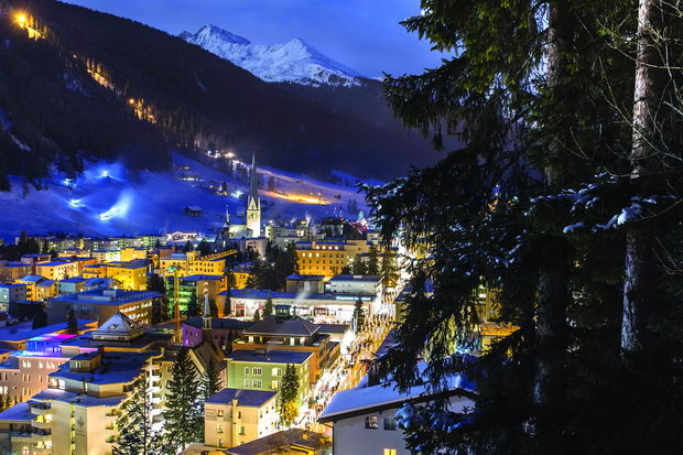 DAVOS, SWITZERLAND city night aerial panorama in winter. Winter ski sports resort and home of the WORLD ECONOMIC FORUM