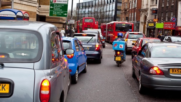 A queue of cars stuck in a heavy traffic jam, Islington High St, London, Greater London, England, UK