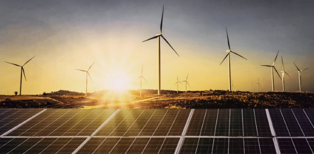 solar panels with wind turbine and sunset .concept power energy in nature
