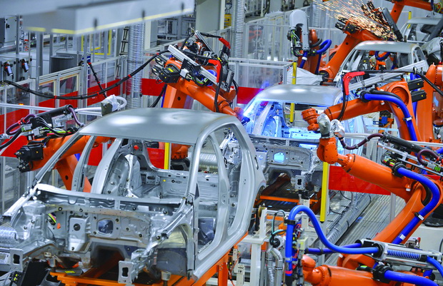 robots welding in factory
