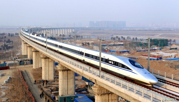 A high-speed train travelling to Guangzhou is seen running on Yongdinghe Bridge in Beijing
