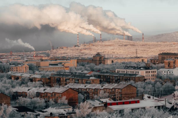 View of Magnitogorsk in winter. Pollution of the atmosphere by factories.
