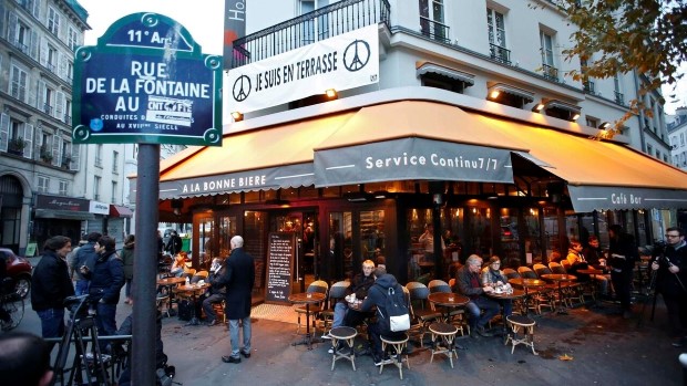 Customers sit on the terrace of the "A La Bonne Biere" cafe in Paris as it re-opens for business three weeks after shooting attacks which killed 130 people in the French capital